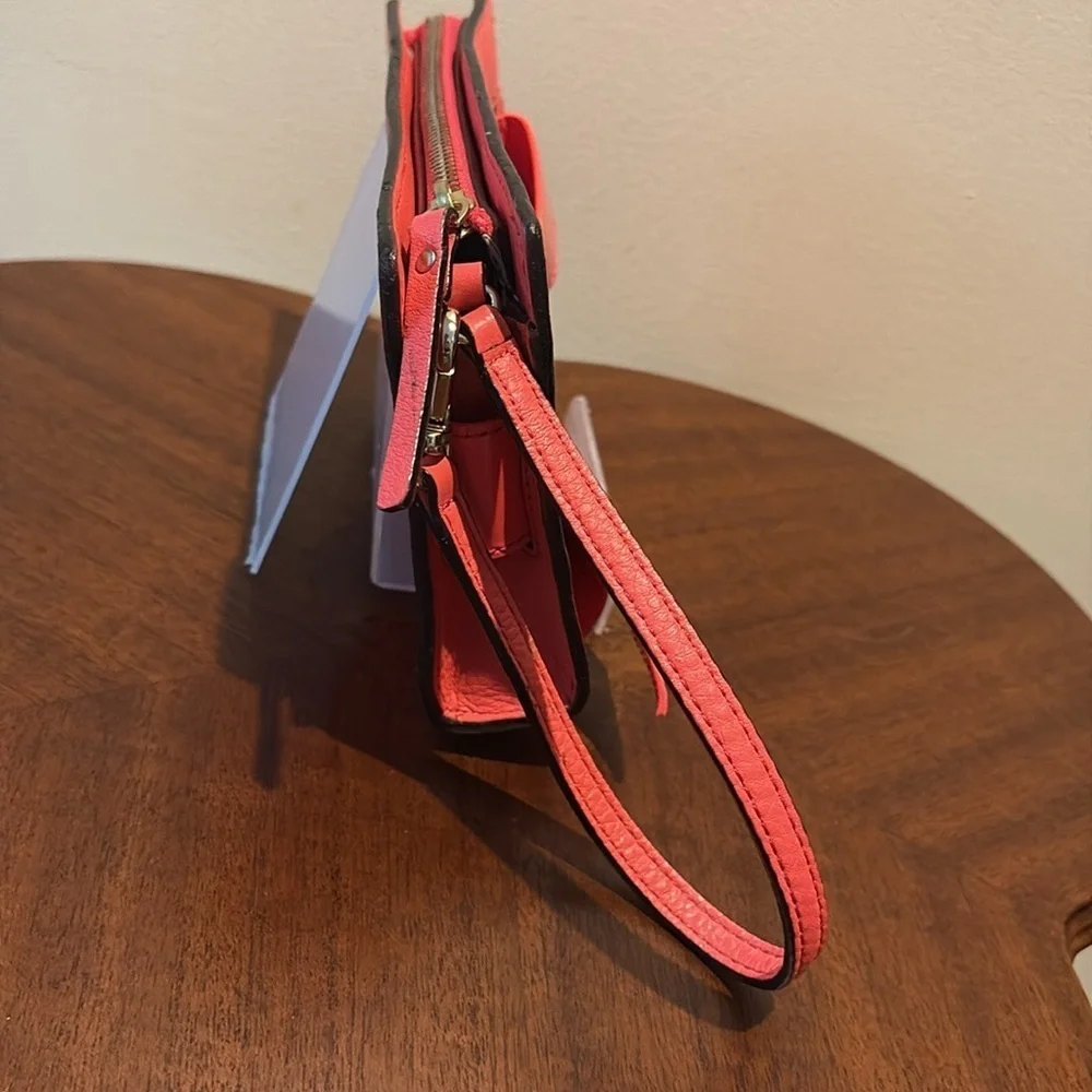Kate Spade wristlet  pebble leather/patent bow on front  orangeish red gold NWOT